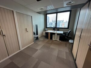 Office with two desks, chairs, and large cabinets.